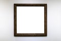 Square dark brown picture frame on white wall Royalty Free Stock Photo