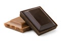 Square of dark chocolate resting on a square of milk chocolate isolated on white. Rough edges Royalty Free Stock Photo