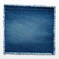 Square denim patch with frayed edges and white stitching on a white background jeans fabric Royalty Free Stock Photo