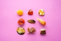 A square of different minerals on pink background. Spiritual amber, calcite, Aragonite, Simbercite, Jasper, Tiger`s eye