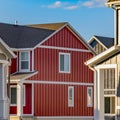 Square Dry cracked ground between houses lit by sunlight on a sunny day Royalty Free Stock Photo