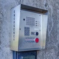 Square Emergency security box with call button mounted on the wall of campus building