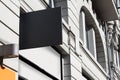 Square empty signboard on a building with classical architecture Royalty Free Stock Photo