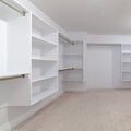 Square Empty white shelves in a fitted walk-in wardrobe Royalty Free Stock Photo