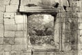 A square empty window in an old stone wall. Black and white image Royalty Free Stock Photo