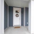 Square Exterior of a front porch of a house with gray and white tones Royalty Free Stock Photo
