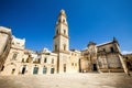 Square of the famous basilica Church of the Holy Cross. Historic city of Lecce, Italy. Blue sky cloudless Royalty Free Stock Photo