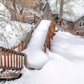 Square Flight of wooden stairs and hill slope covered with thick fresh snow in winter Royalty Free Stock Photo