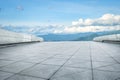 Square floor and mountain skyline background