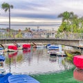 Square Footbridge over canal with stairs going to boat docks in Long Beach California