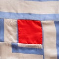 Square fragment of hand-stitched patchwork cloth Royalty Free Stock Photo