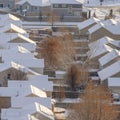 Square frame Aerial view of Utah Valley neighborhood with homes and roads on snowy winter day Royalty Free Stock Photo
