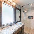 Square frame Bathroom interior with tile walls, warm lightnings and sliding window panel with mirror Royalty Free Stock Photo