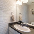 Square frame Bathroom interior with vanity sink and white bricks wall Royalty Free Stock Photo