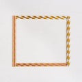 Square Frame from bright multicolor paper drinking straws with Gold striped on light background Royalty Free Stock Photo