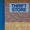 Square frame Building with pitched roof and large blue door viewed on a sunny day Royalty Free Stock Photo