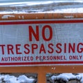 Square frame Close up of No Trespassing signage with snowy Utah Lake background in winter Royalty Free Stock Photo