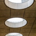 Square frame Close up of round skylights in a row viewed from inside a building Royalty Free Stock Photo