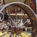 Square frame Close up of the rusty wheels of an old vintage tractor on a farm on a sunny day Royalty Free Stock Photo