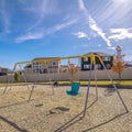 Square frame Colorful A-frame swing in a kids playground Royalty Free Stock Photo