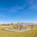 Square frame Colorful kids playground in a grassed urban park Royalty Free Stock Photo