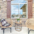 Square frame Comfortable wicker chairs on a veranda day light Royalty Free Stock Photo