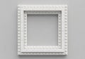 Square frame constructed from interlocking white plastic bricks resembling LEGO. The frame is Royalty Free Stock Photo