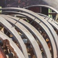 Square frame Damaged and rusty wheels of an old vintage tractor on a farm on a sunny day Royalty Free Stock Photo