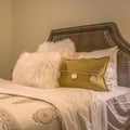 Square frame Double bed with fluffy pillows against the upholstered belgrave headboard