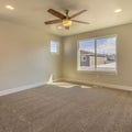 Square frame Empty room of a new house with beige wall paint and carpeted floor