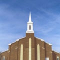 Square frame Exterior view of a magnificent church with cloudy blue sky background Royalty Free Stock Photo
