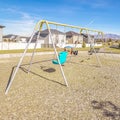 Square frame A-frame swings in a kids playground during day Royalty Free Stock Photo