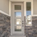 Square frame Glass entrance door to a modern home