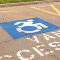 Square frame Handicapped parking lot with painted handicap symbol and Van Accessible sign Royalty Free Stock Photo