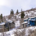 Square frame Homes on residential mountain neighborhood in snowy Park City Utah in winter Royalty Free Stock Photo
