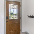 Square frame Interior of a front door with wall rail-mounted hanging hooks