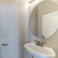 Square frame Interior of a small white bathroom with sink and mirror Royalty Free Stock Photo