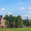 Square frame Luxury houses and golf course with mountain and blue sky in the background Royalty Free Stock Photo