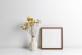 Square frame mockup over white wall with copy space for artwork, photo or print presentation Royalty Free Stock Photo