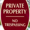 Square frame Oval shape Private Property No Trespassing sign with red and white colors