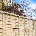 Square frame Residential mailboxes with numbered compartments on the side of a road