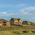 Square frame Sand trap and fairway at a golf course with multi storey homes in the background Royalty Free Stock Photo