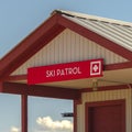 Square frame Ski Patrol building with stairs going to porch and red front door in Park City Royalty Free Stock Photo