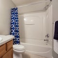 Square frame Small bathroom interior with a vanity unit and toliet against the white wall Royalty Free Stock Photo