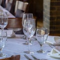 Square frame Tableware arranged on round table with white cloth for eating at an occasion Royalty Free Stock Photo