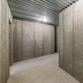 Square frame Unfinished empty cold storage room in a basement of a house Royalty Free Stock Photo