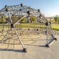 Square frame Urban climbing dome with nets in a kids playground Royalty Free Stock Photo