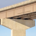 Square frame View beneath a stringer bridge with massive abutment that supports the deck