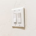 Square frame Wall mounted electrical rocker light switch with multiple flat broad levers