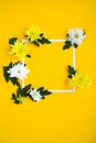 Square frame. white and yellow chrysanthemums on a yellow background